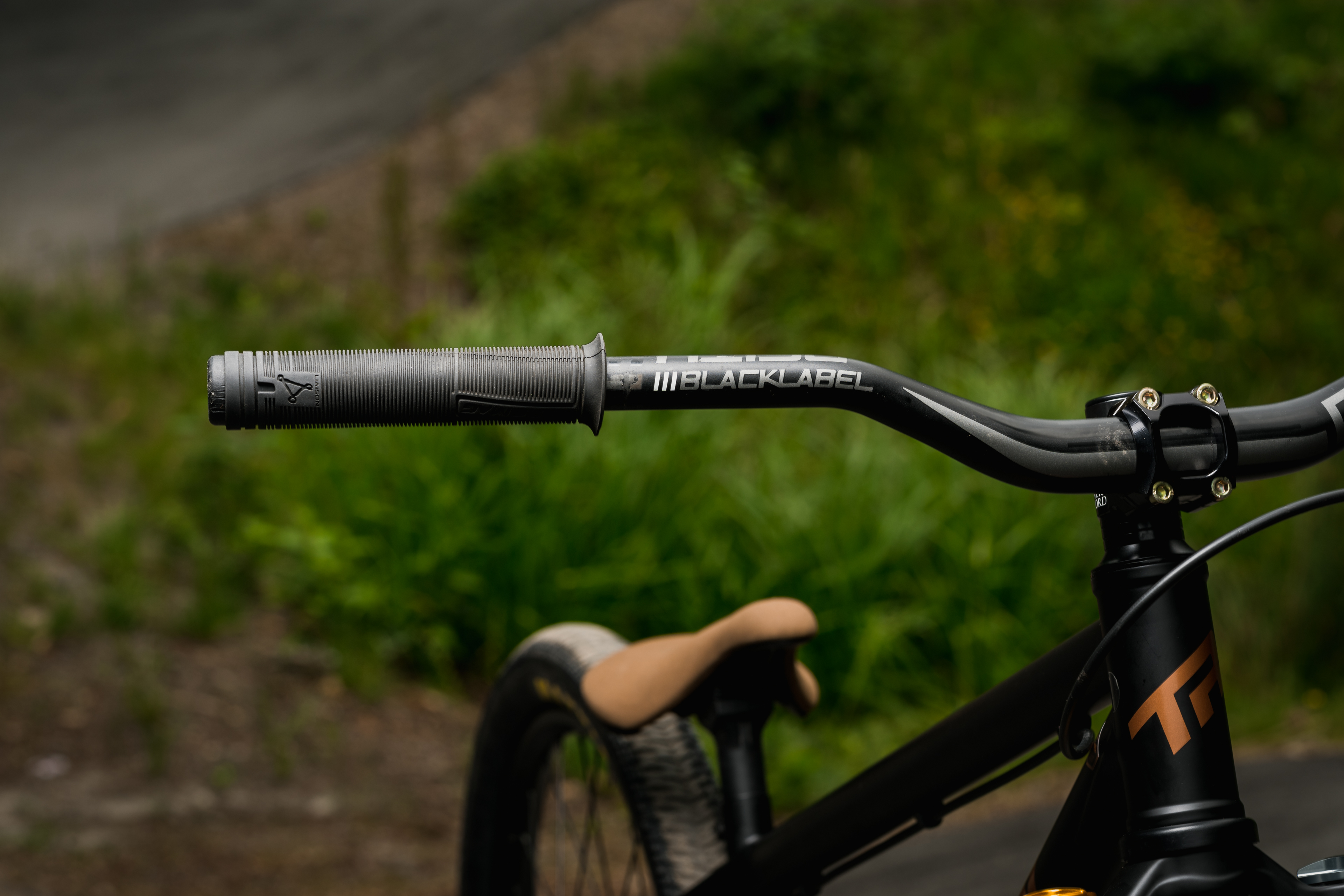 Chromag Wax grips and Deity Black Label 38mm rise handlebar shot by A.J. Barlas at the Squamish Casino pumptrack